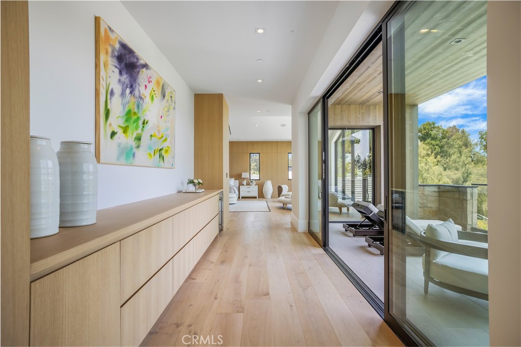 24105 Hidden Ridge Road Hidden Hills, CA 91302 - Photo 25 of 52 a large white room with a large window