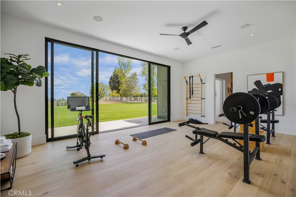 24105 Hidden Ridge Road Hidden Hills, CA 91302 - Photo 27 of 52 a view of a livingroom with gym equipment