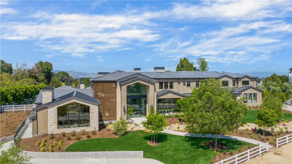 24105 Hidden Ridge Road Hidden Hills, CA 91302 - Photo 49 of 52 a front view of a house with garden