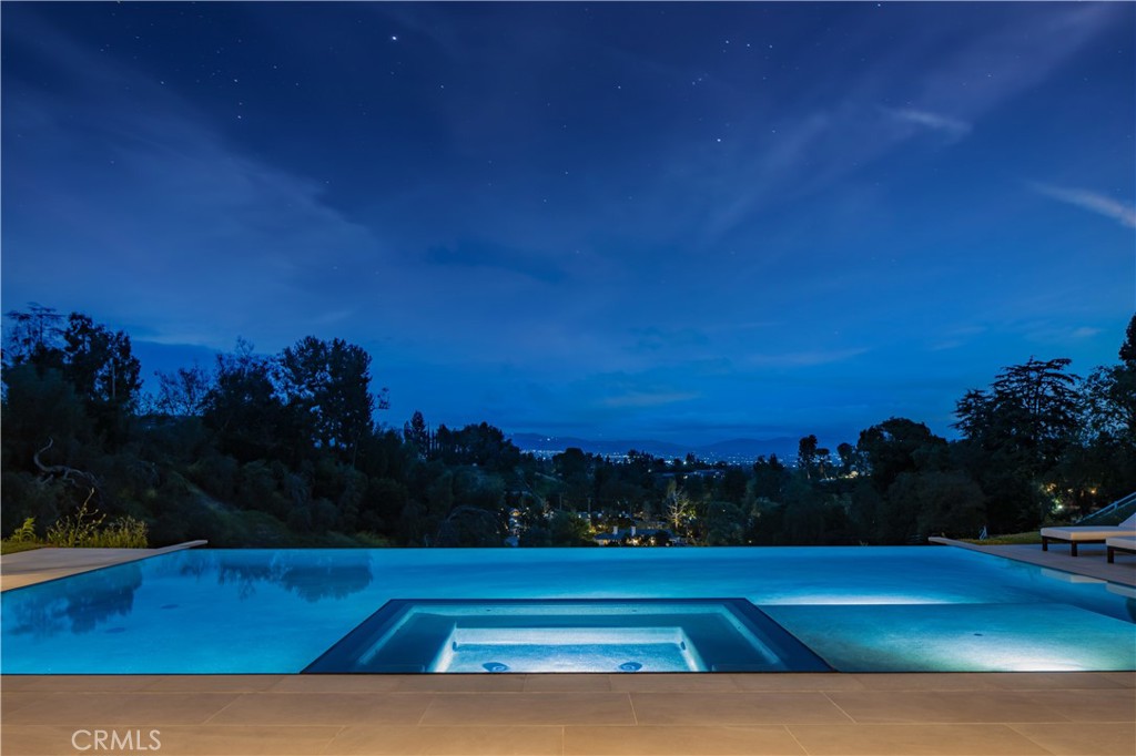 24105 Hidden Ridge Road Hidden Hills, CA 91302 - Photo 50 of 52 a view of swimming pool and mountain in the background
