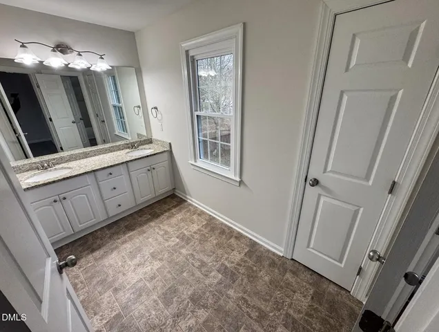 a backyard of a house with fire pit and couch