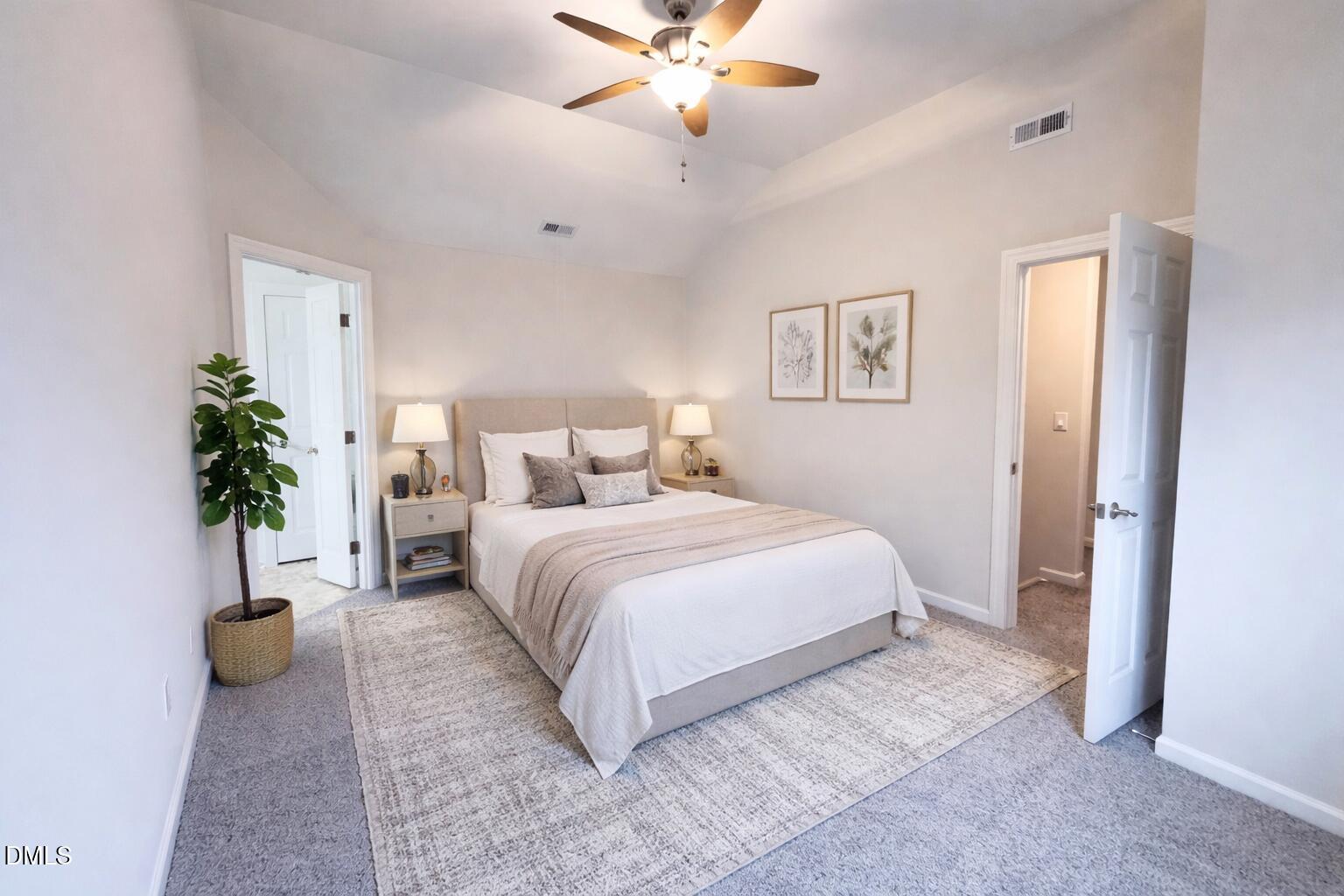 4204 Belington Court Raleigh, NC 27604 - Photo 15 of 26 a bedroom with a large bed and a potted plant