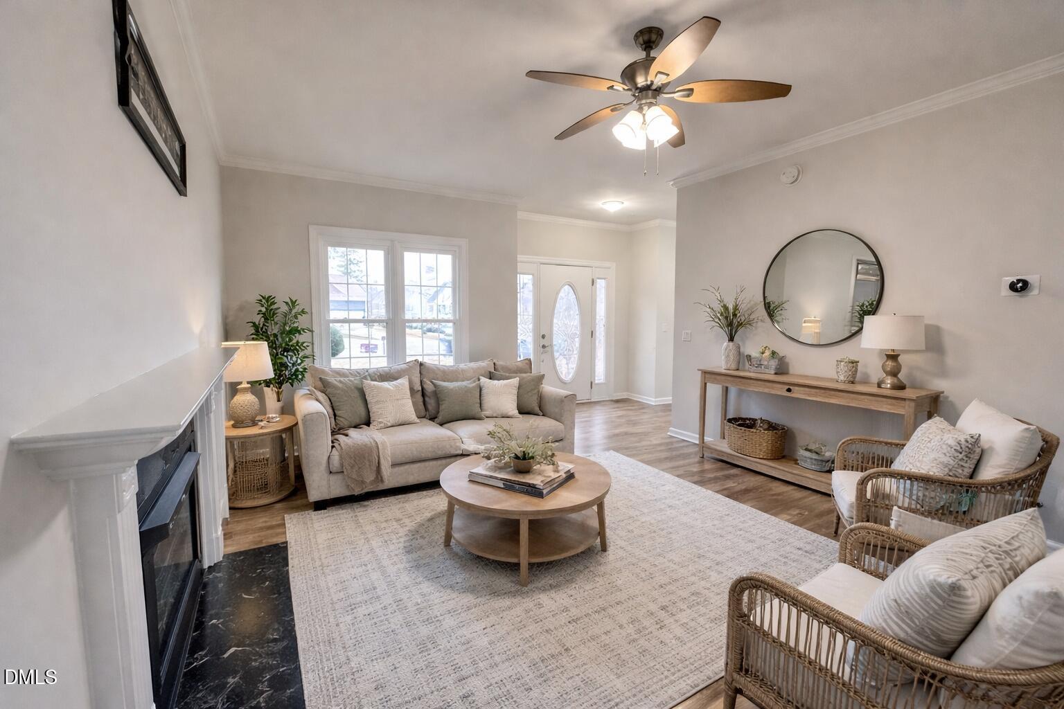 4204 Belington Court Raleigh, NC 27604 - Photo 3 of 26 a living room with furniture a window and a fireplace