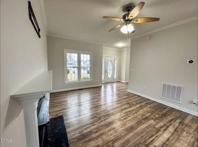 wooden floor in an empty room with a window
