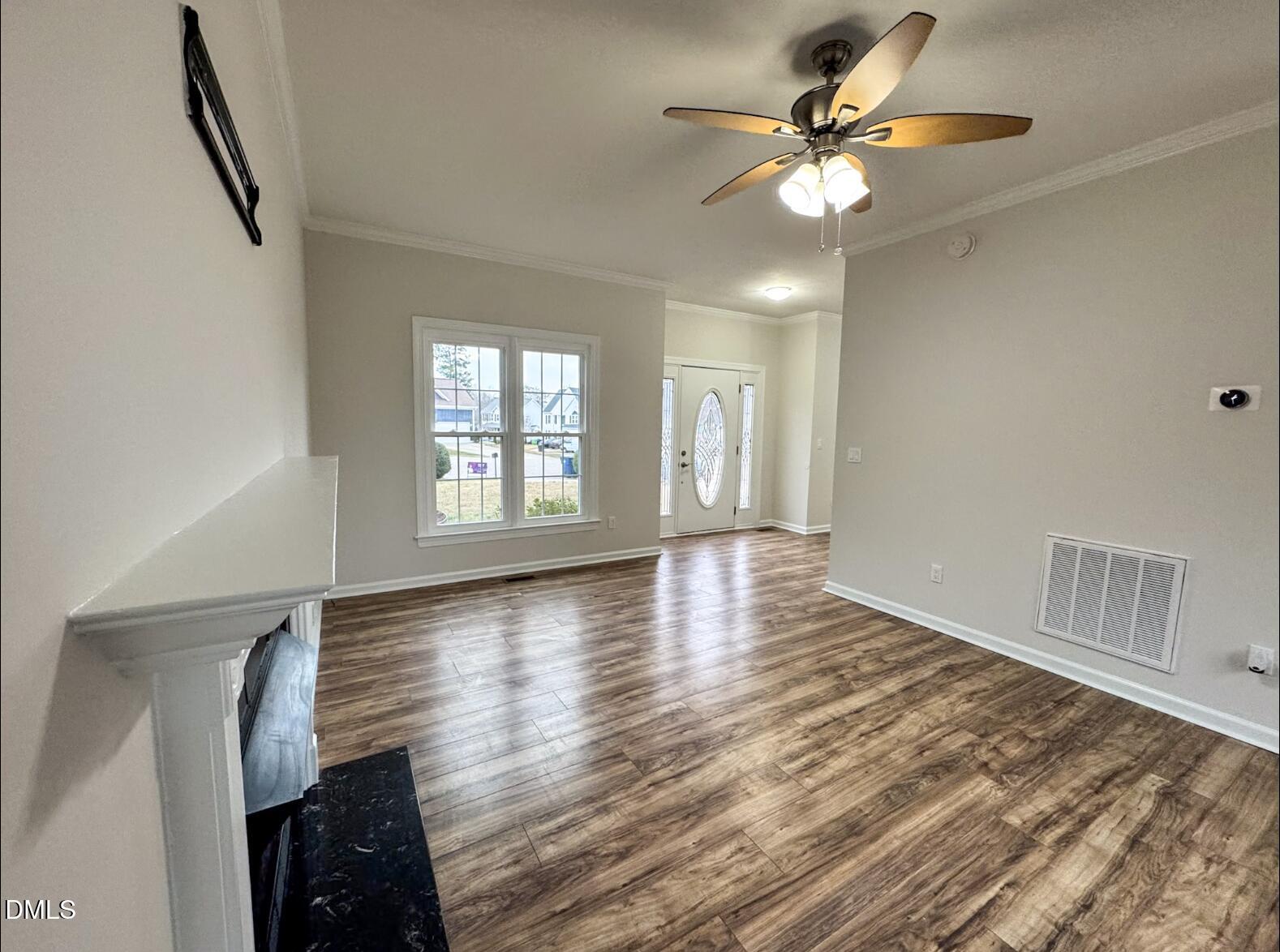 4204 Belington Court Raleigh, NC 27604 - Photo 3 of 18 wooden floor in an empty room with a window