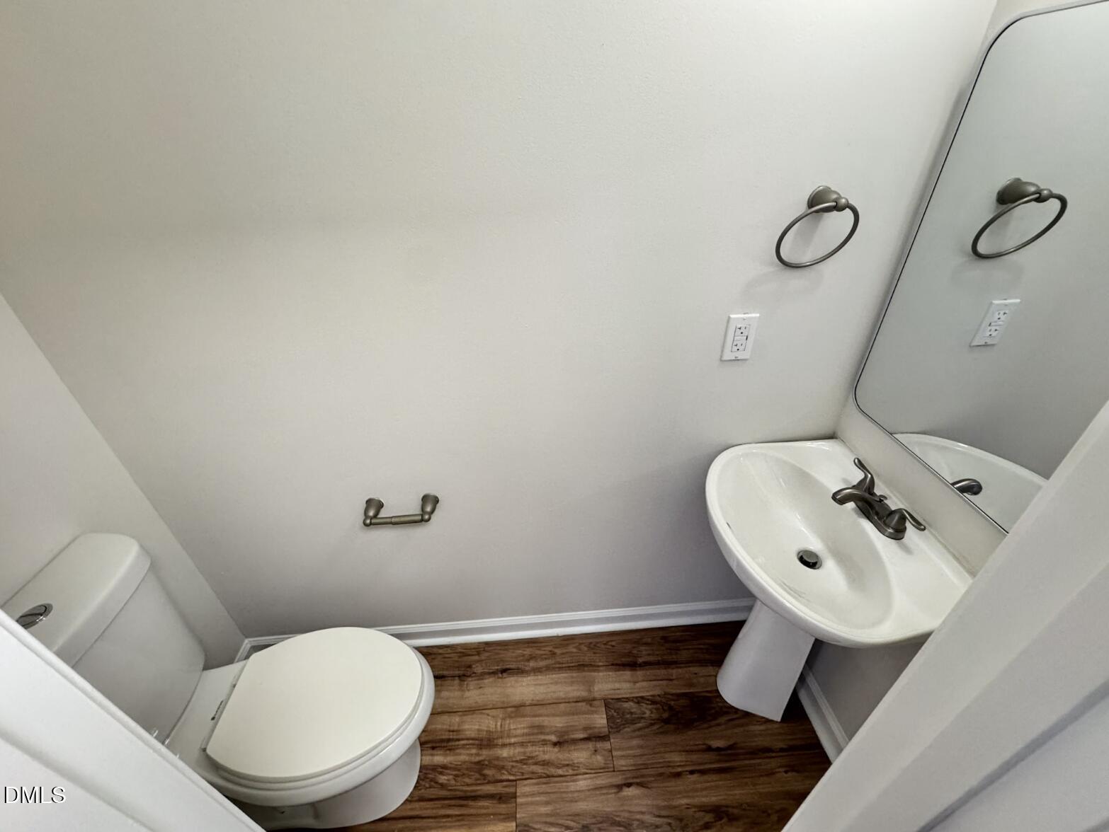 4204 Belington Court Raleigh, NC 27604 - Photo 10 of 26 a bathroom with a toilet sink and mirror