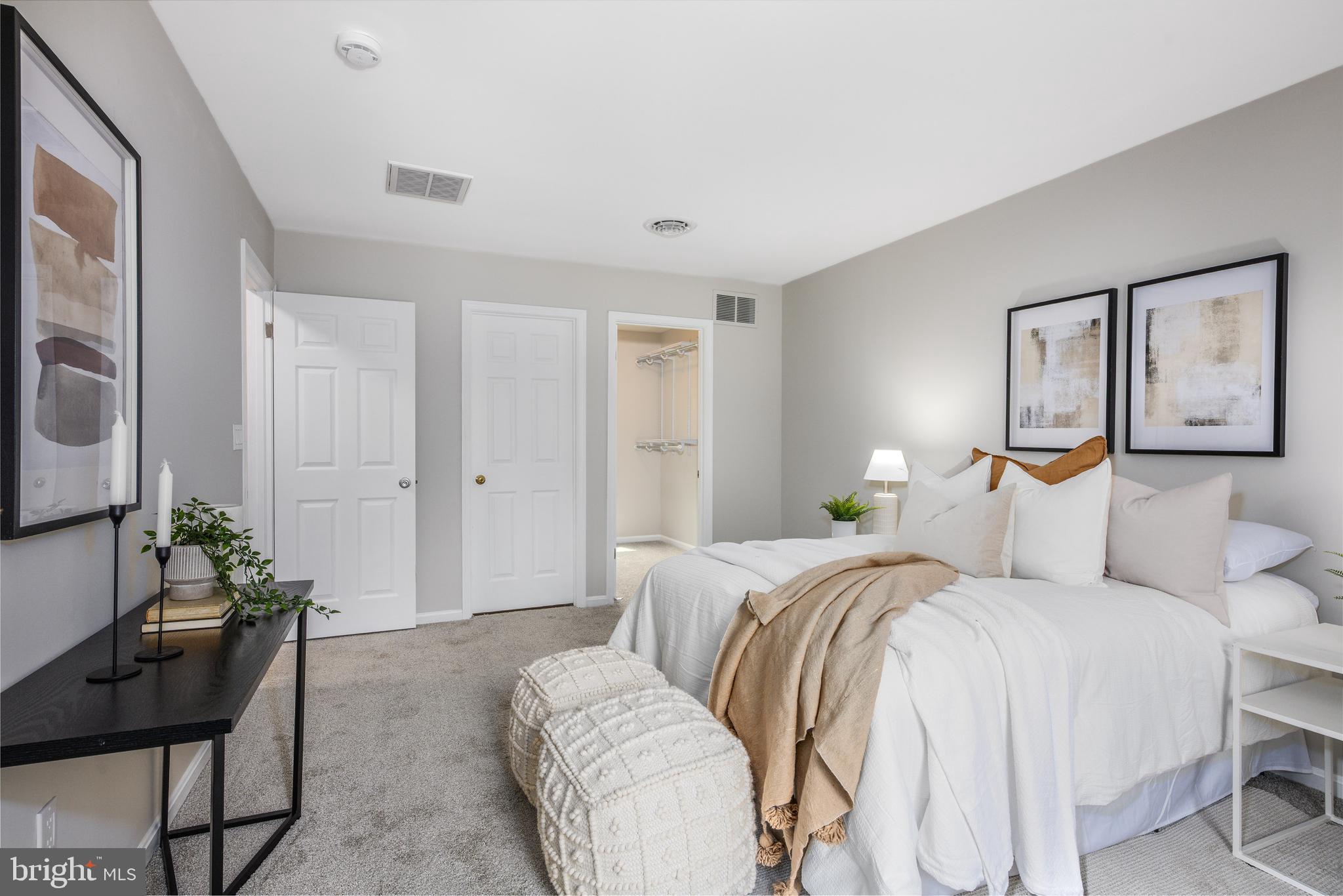 525 Upton Road Severn, MD 21144 - Photo 24 of 51 a bedroom with a balcony a bed and a couch