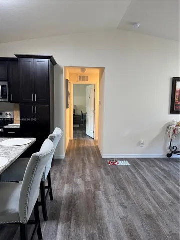 a view of a livingroom with furniture and wooden floor