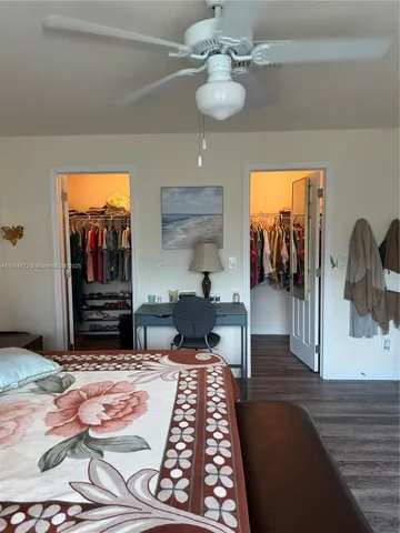 a bedroom with furniture and a chandelier