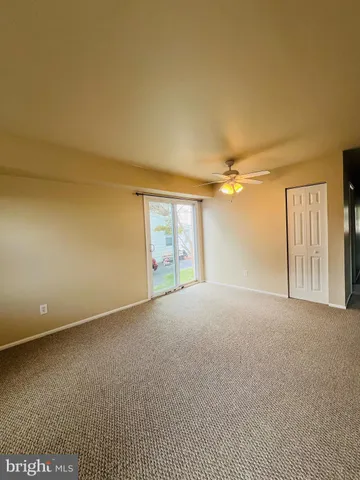a view of empty room with windows