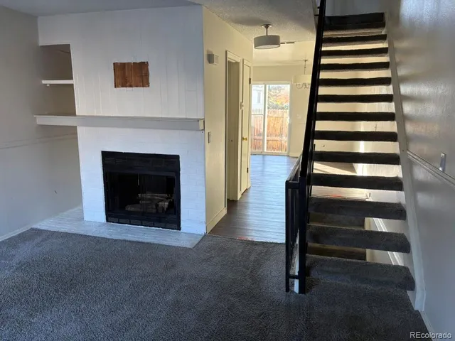 a view of a livingroom with a fireplace