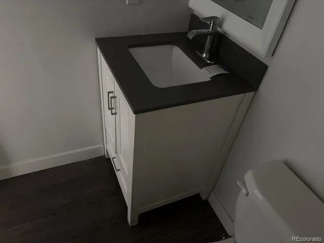 a bathroom with a sink and toilet