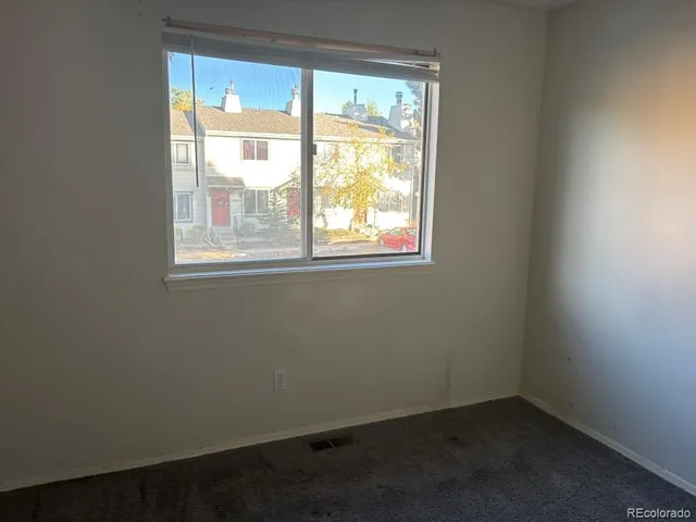a view of a deck with wooden fence