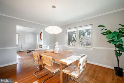 a bedroom with a bed and chandelier