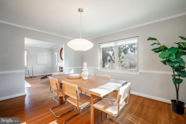 a bedroom with a bed and chandelier