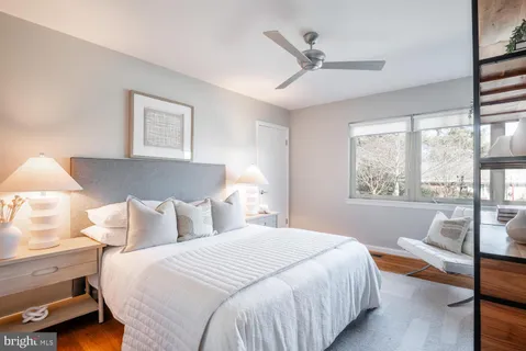 a bedroom with a bed and a couch