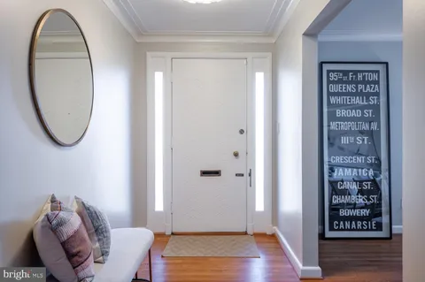 a living room with furniture a fireplace and a large window