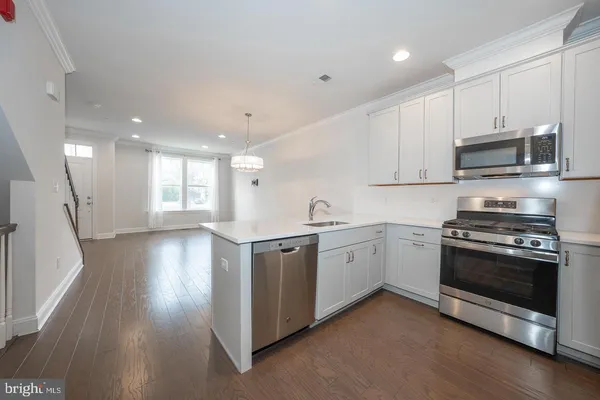a kitchen with a refrigerator a sink and dishwasher