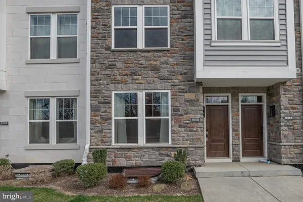 a front view of a brick house many windows