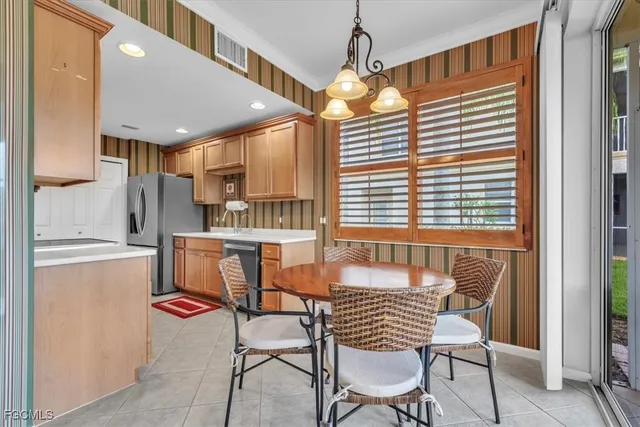 a dining room with furniture and window