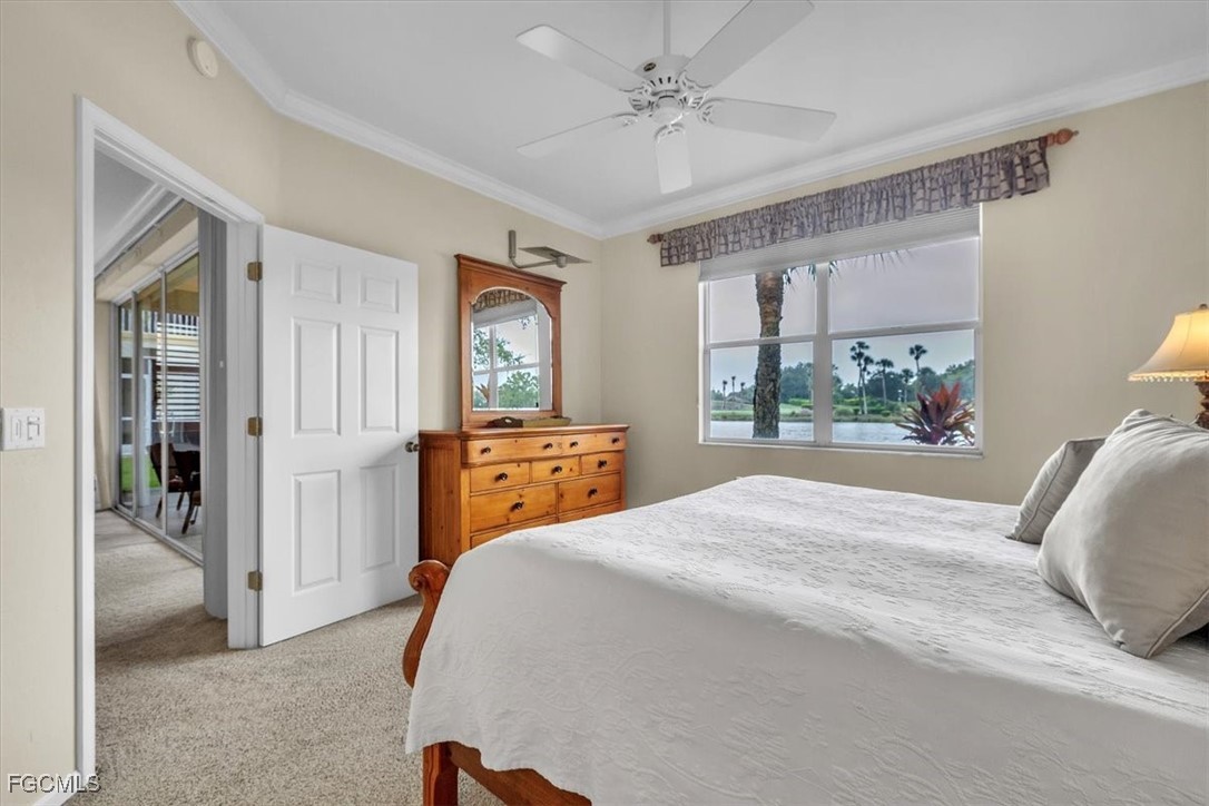 3110 Meandering Way, Unit 101 Fort Myers, FL 33905 - Photo 22 of 50 a bedroom with a bed and a painting on the wall