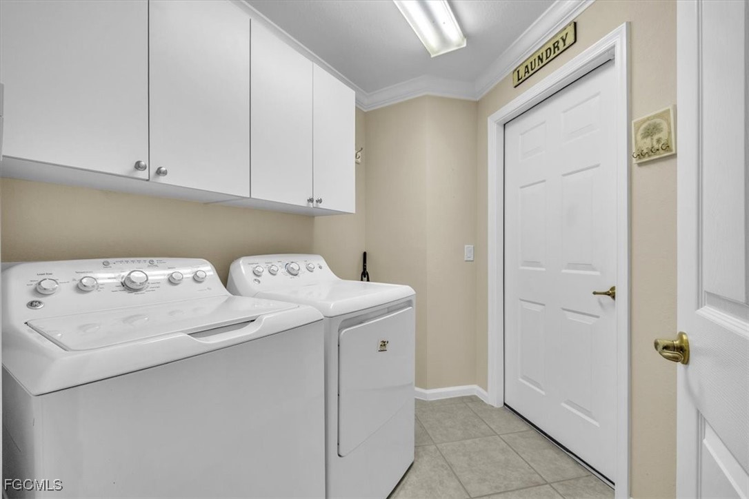 3110 Meandering Way, Unit 101 Fort Myers, FL 33905 - Photo 38 of 50 a utility room with dryer and washer