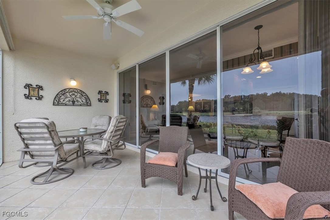 3110 Meandering Way, Unit 101 Fort Myers, FL 33905 - Photo 40 of 50 a view of a livingroom with furniture and a floor to ceiling window