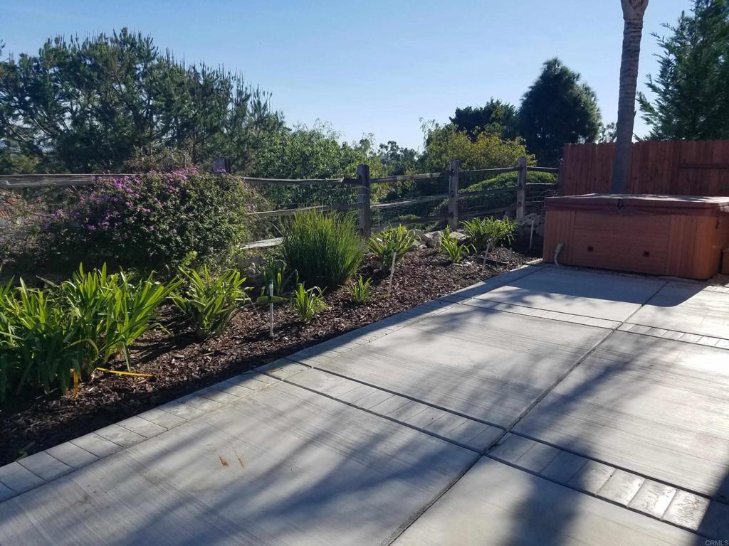 5132 Via Seville Oceanside, CA 92056 - Photo 7 of 7 a backyard of a house with lots of green space