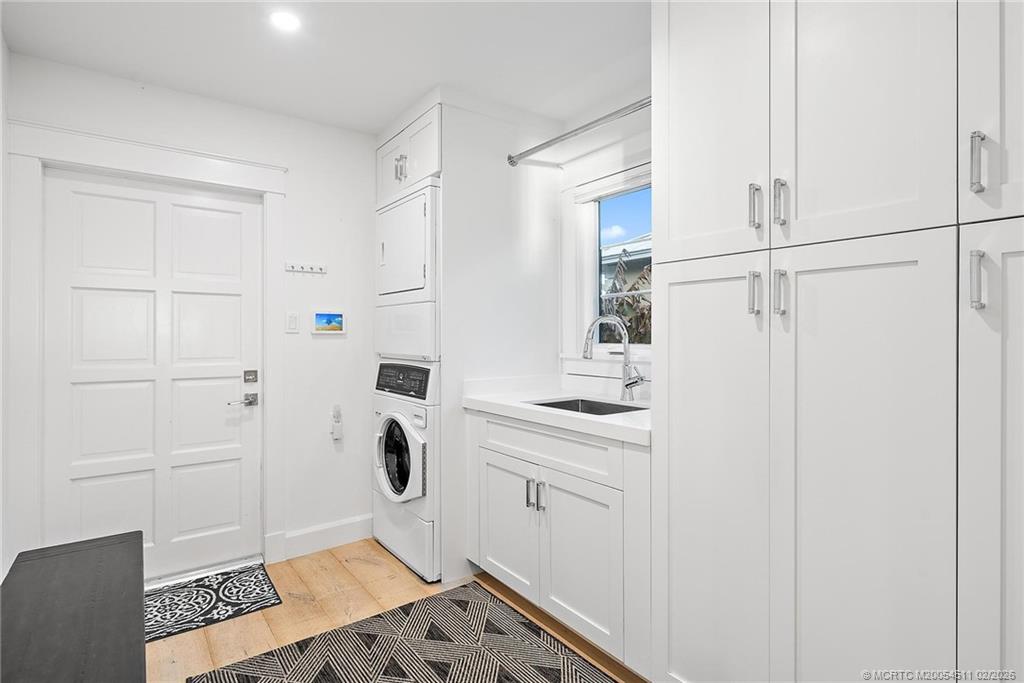 4230 Northeast Joes Point Road Jensen Beach, FL 34957 - Photo 24 of 62 a room with white cabinets and white appliances