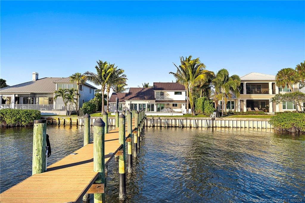 4230 Northeast Joes Point Road Jensen Beach, FL 34957 - Photo 48 of 62 a view of building with lake view