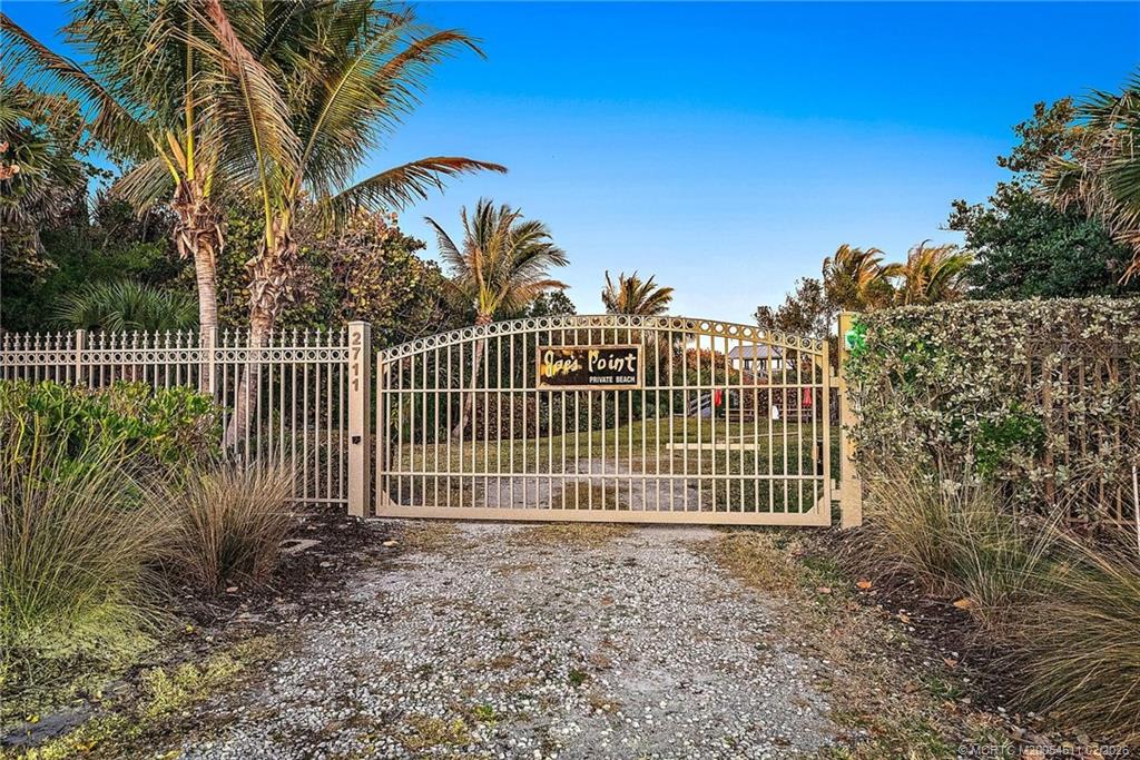 4230 Northeast Joes Point Road Jensen Beach, FL 34957 - Photo 62 of 62 a view of a house with a small yard and plants