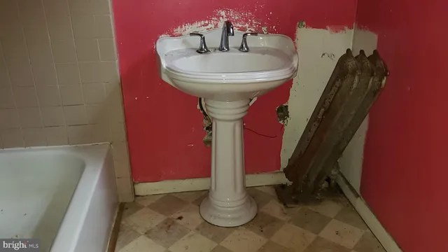 a bathroom with a sink and toilet