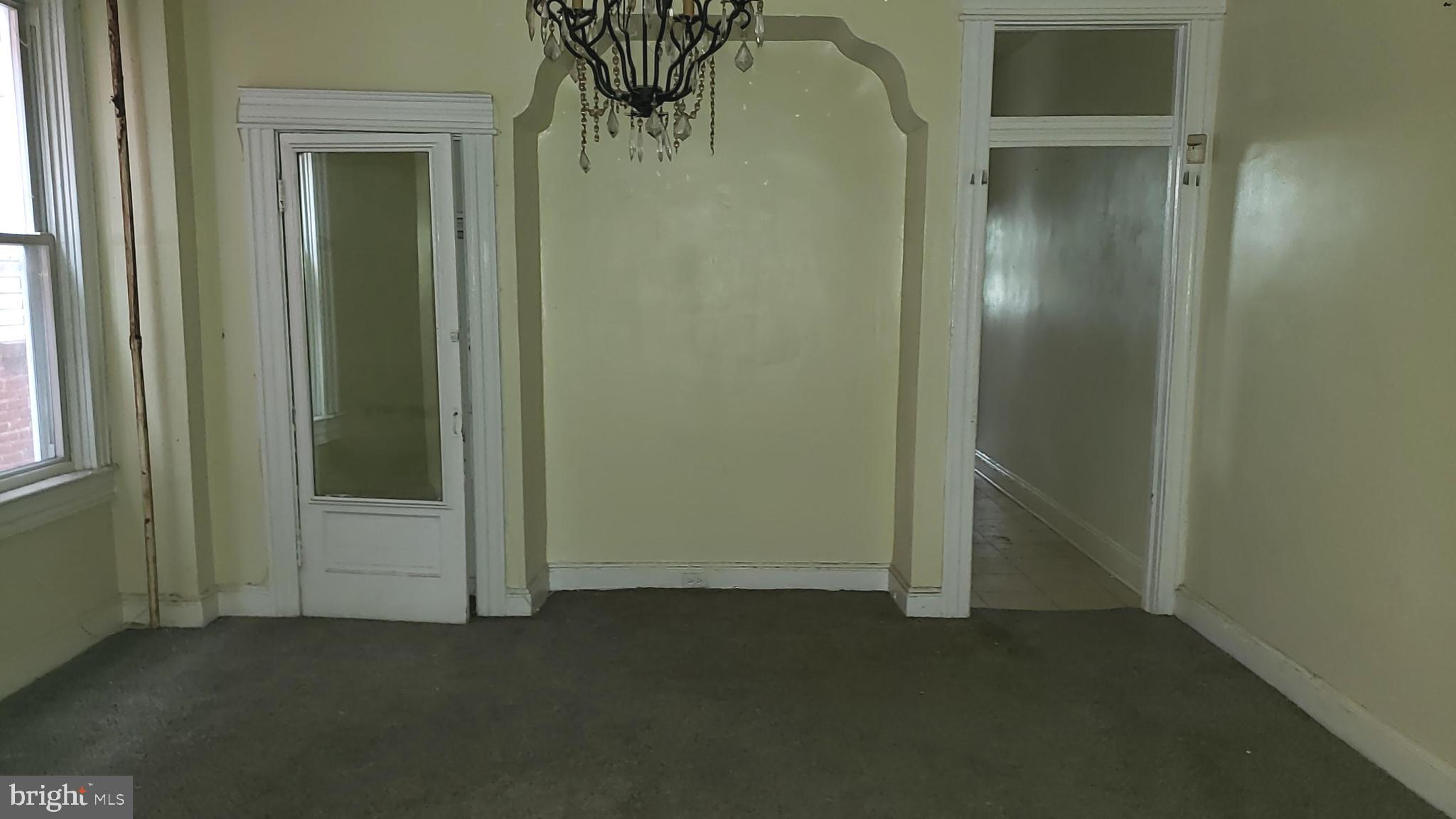 2215 Mt Holly Street Baltimore, MD 21216 - Photo 9 of 12 an empty room with windows