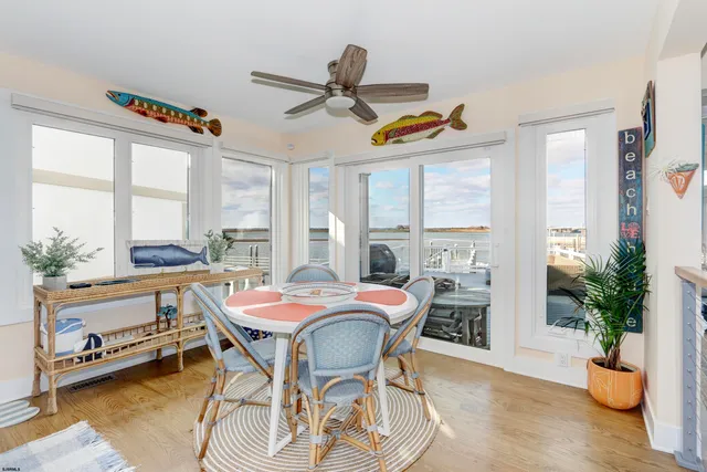 a dining room with a table and chairs