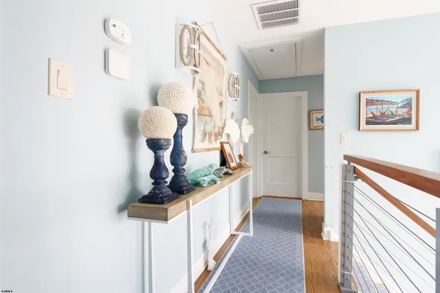 a hallway with a chandelier