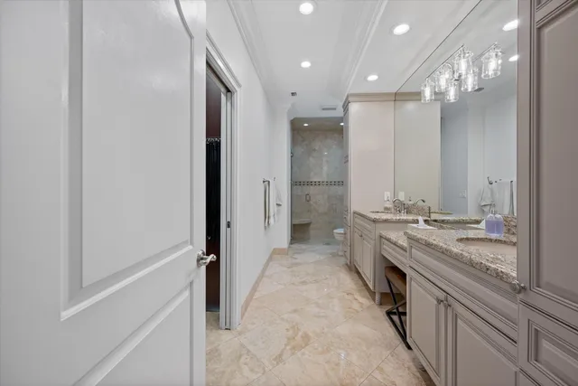 a large kitchen with a sink and a large mirror