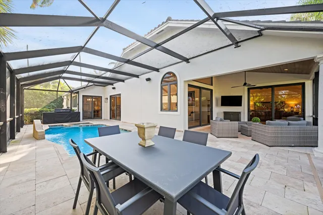 a view of a dining room with furniture and window