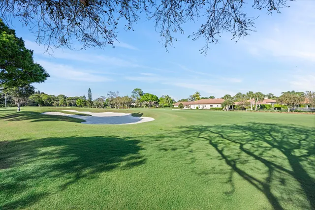 a view of a golf course with a field