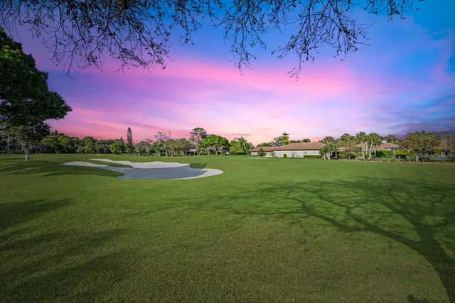 a view of a lake with a house in background