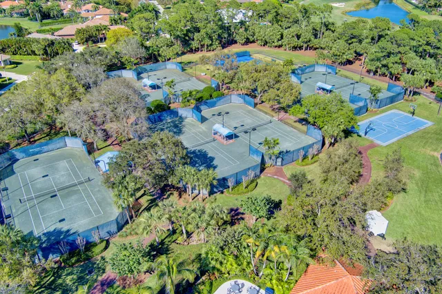 an aerial view of a house with yard swimming pool and outdoor seating