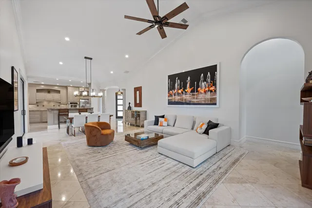 a living room with furniture a rug and a flat screen tv