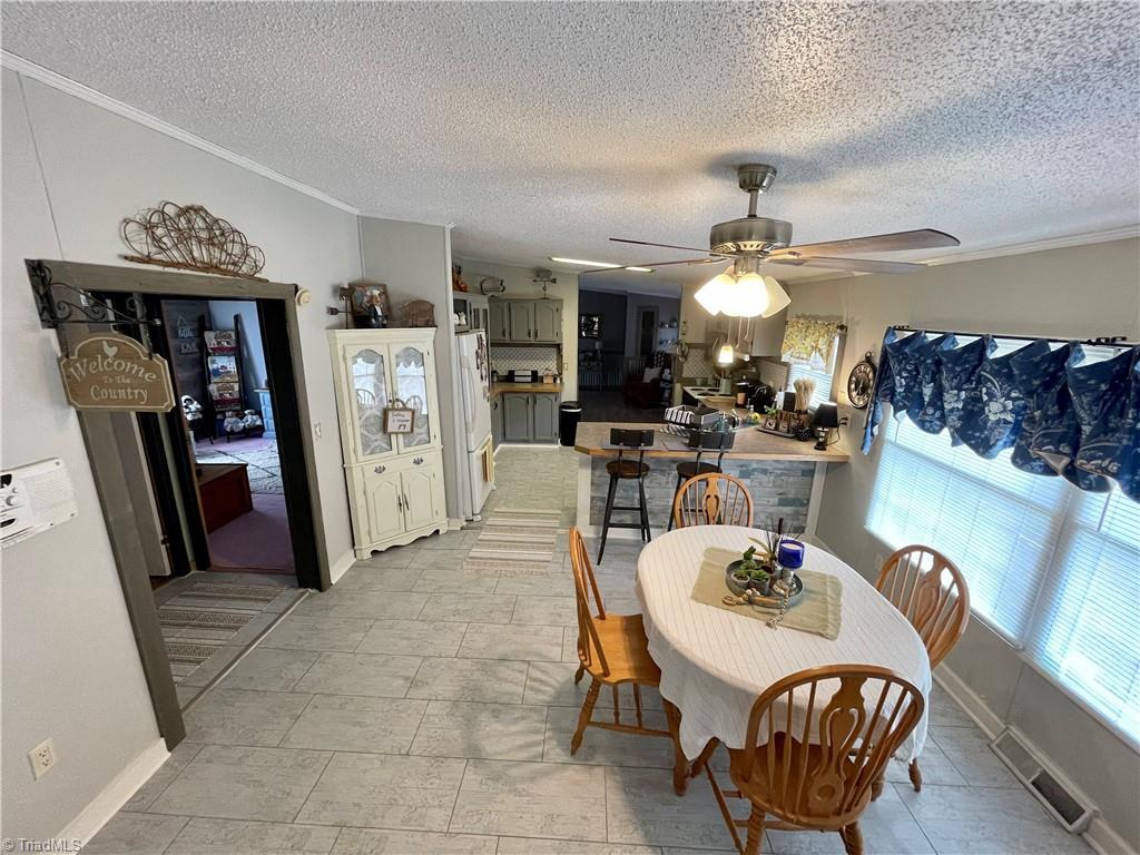 2346 Duggins Road Madison, NC 27025 - Photo 5 of 31 Large dining area beside the eat-in-kitchen