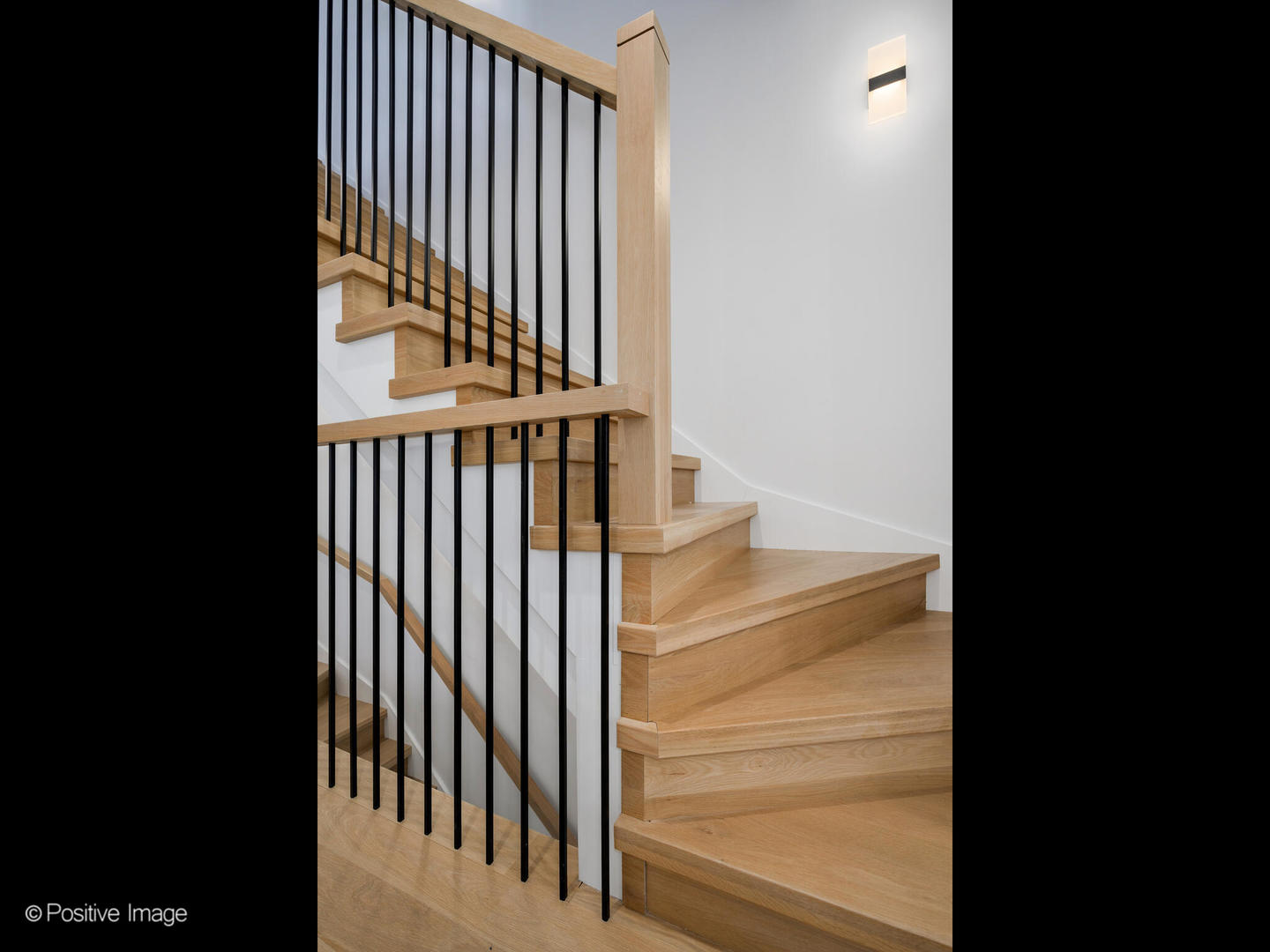 867 North Marshfield Avenue, Unit 3 Chicago, IL 60622 - Photo 11 of 26 a view of staircase with black white wall