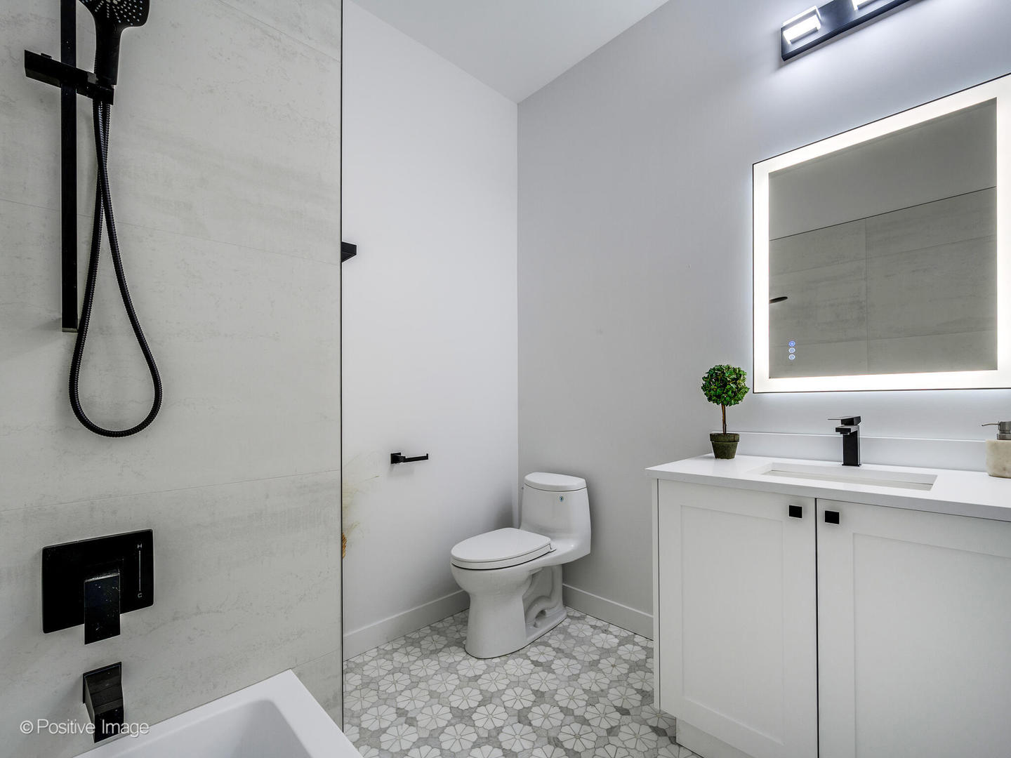 867 North Marshfield Avenue, Unit 3 Chicago, IL 60622 - Photo 24 of 26 a bathroom with a toilet sink and a mirror