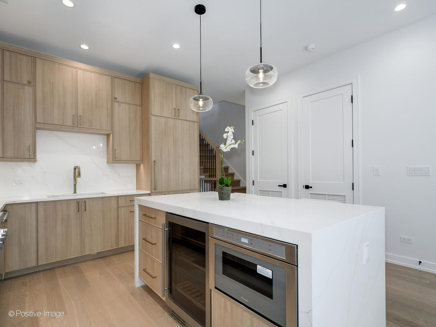 867 North Marshfield Avenue, Unit 3 Chicago, IL 60622 - Photo 7 of 26 a kitchen with a stove a sink and a refrigerator