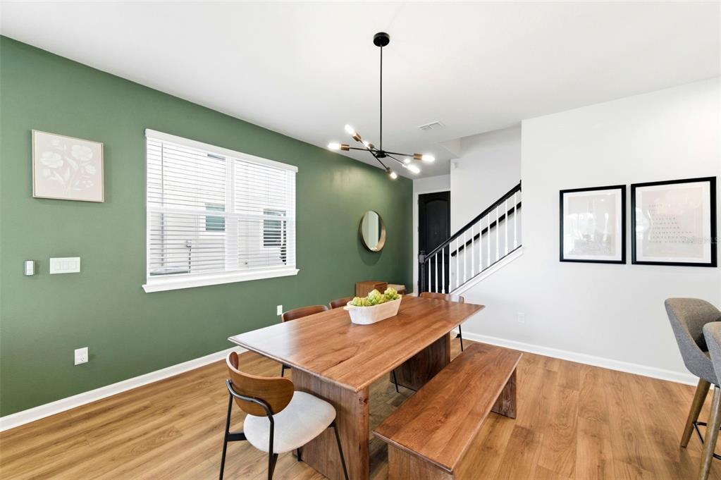 4327 Cloud Hopper Way Lutz, FL 33559 - Photo 11 of 75 a view of a dining room with furniture window and wooden floor