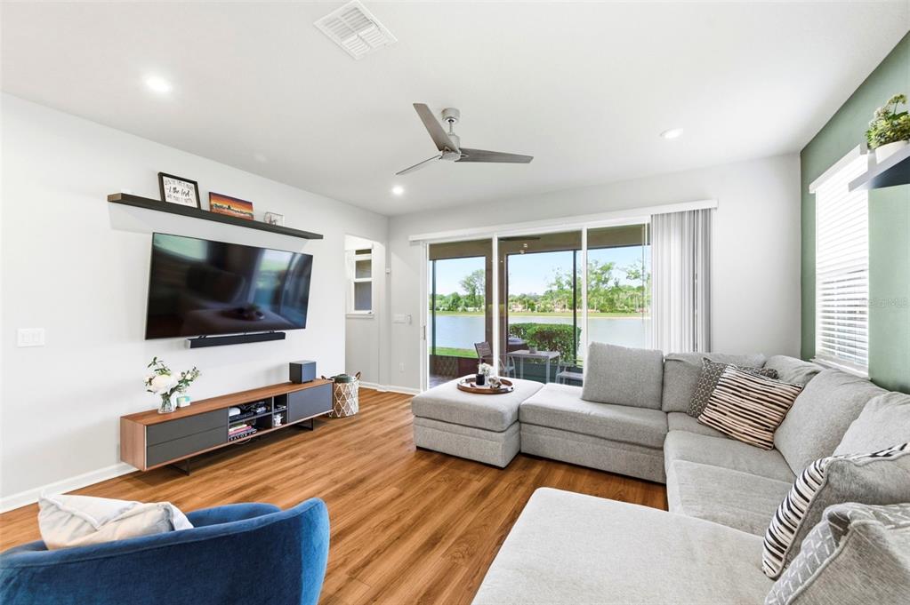 4327 Cloud Hopper Way Lutz, FL 33559 - Photo 15 of 75 a living room with furniture and a flat screen tv