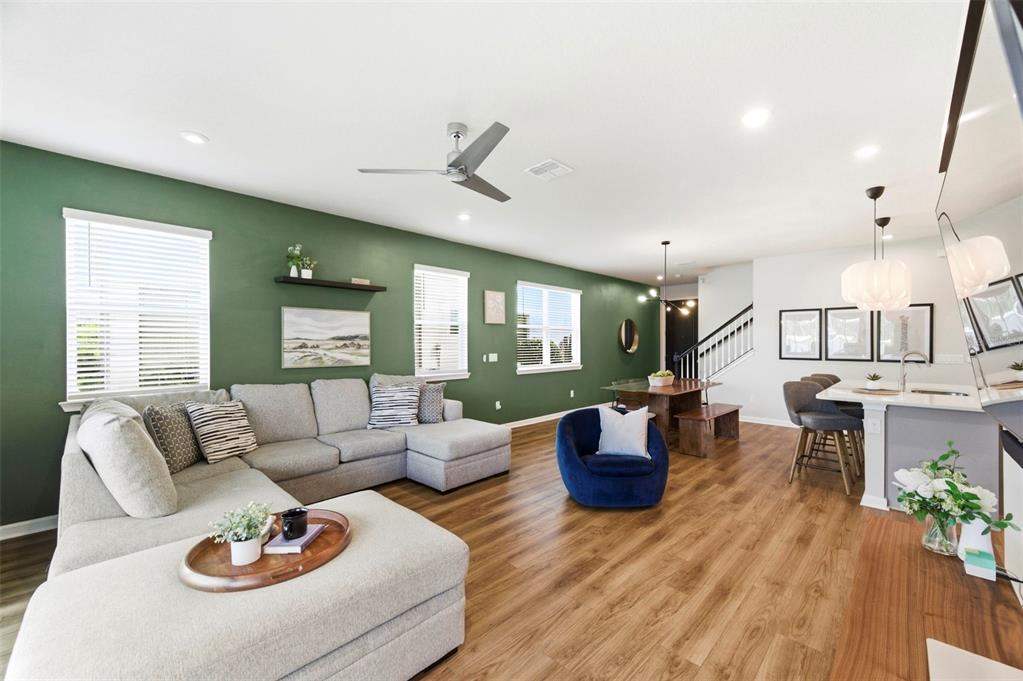 4327 Cloud Hopper Way Lutz, FL 33559 - Photo 16 of 75 a living room with furniture and wooden floor