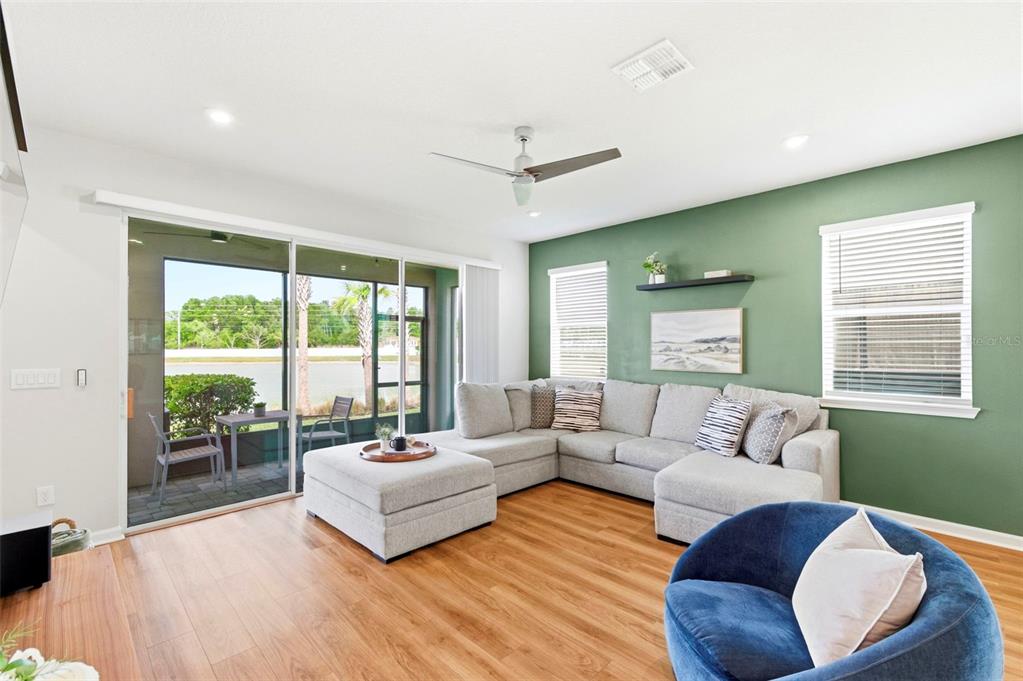 4327 Cloud Hopper Way Lutz, FL 33559 - Photo 17 of 75 a living room with furniture and a large window