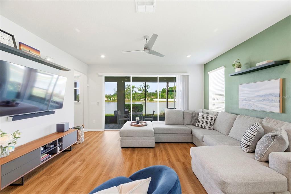 4327 Cloud Hopper Way Lutz, FL 33559 - Photo 18 of 75 a living room with furniture and a flat screen tv